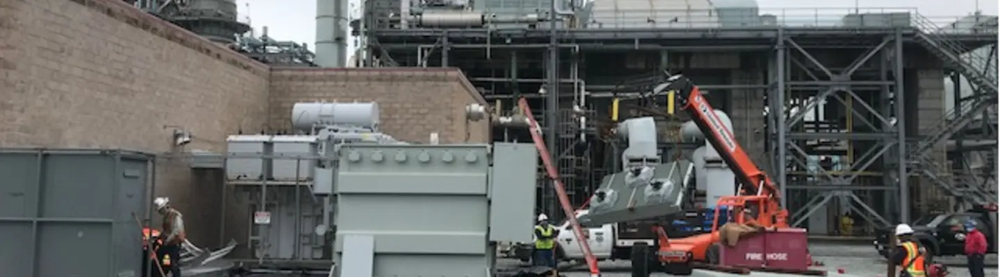 construction equipment and generators outside of power plant