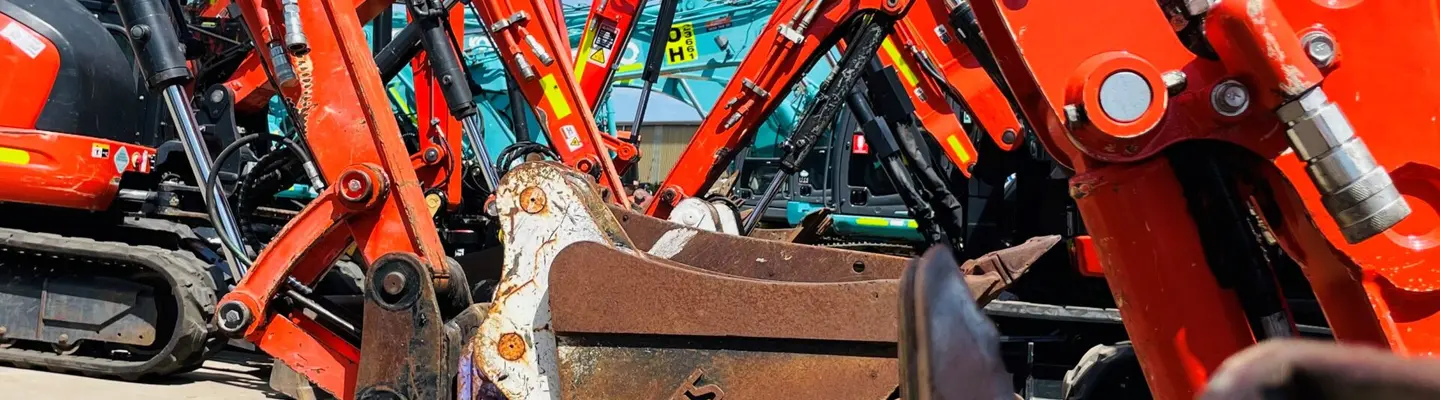 An excavator at a construction site, digging and moving earth as part of site preparation and infrastructure development.