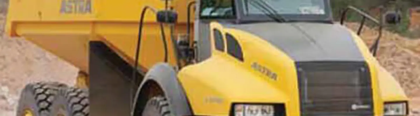 A dumper truck in operation on a construction site, moving earth and materials to support ongoing infrastructure work.