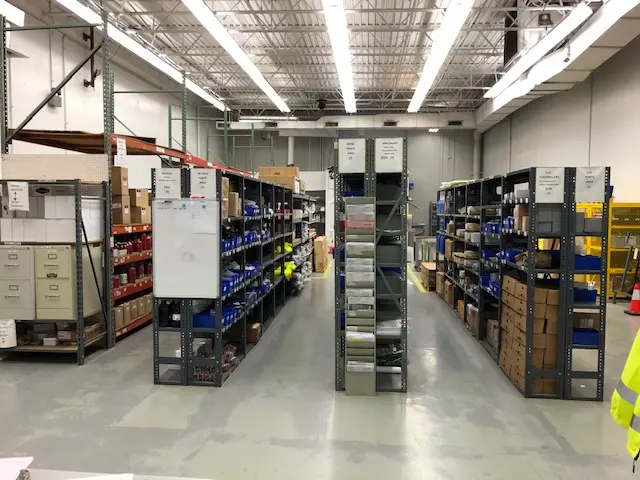 aisles of parts and supplies in a warehouse