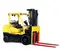 Side view of a yellow Hyster warehouse forklift with black tires, a propane tank, extended red forks and an open cabin.