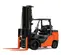 Side view of an orange and black Toyota warehouse forklift with a black mast, orange forks and an open cabin.