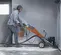 Silver and orange and black HUSQVARNA Walk-behind Concrete Grinder, Electric Powered