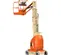 Side view of orange and beige JLG electric vertical mast lift with safety guardrails and compact base.