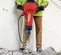Red and black HILTI Demolition Breaker Hammer, Electric-powered, 60 lbs.