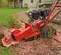 Red and black TORO Stump Grinder, 11-14 HP, Gas Powered