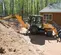Orange and black Case Backhoe Loader with 17 foot Dig Depth and Extendahoe