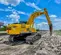 Yellow and black KOBELCO 62,000-63,000 lb. Long-Reach Excavator