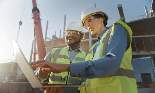 Two workers at jobsite