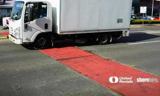 Truck in front of a Steel Road Plate