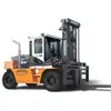 Side view of an orange and white Doosan warehouse forklift with a black lifting mast, black forks and pneumatic tires.