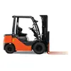 Side view of an orange and black Toyota warehouse forklift with a black mast, orange forks and an open cabin.