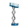 Side view of an extended blue Genie scissor lift with platform with a safety railing.