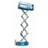 Side view of an extended blue Genie scissor lift with platform with a safety railing.