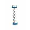 Side view of extended blue Genie scissor lift with a platform with safety rails.