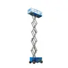 Front angled view of an extended blue Genie scissor lift with guardrails.