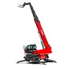 Front view of a red Magni telehandler with extended boom, stabilizers, fork attachments and enclosed cabin.