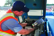 man with gloves near equipment