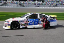 sheldon creed next to his car 