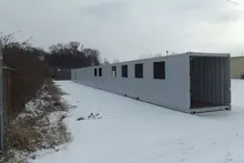 Container covered walkway in snow