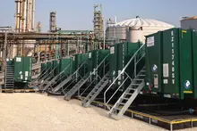 Row of green filtration tanks