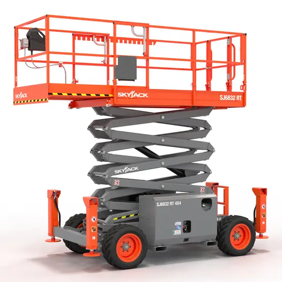 Side view of a retracted orange Skyjack scissor lift with safety rails.